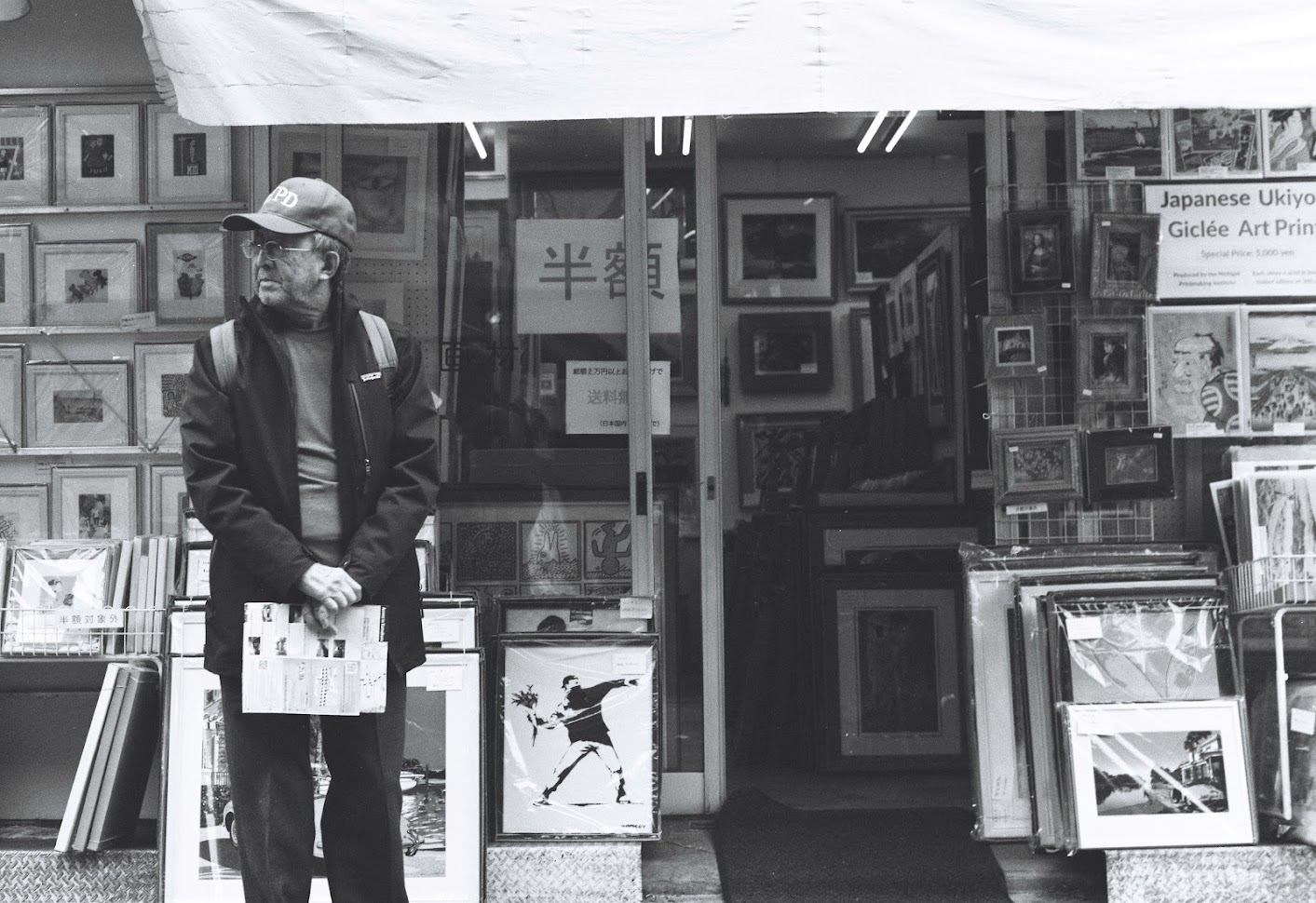 Old man in front of shop